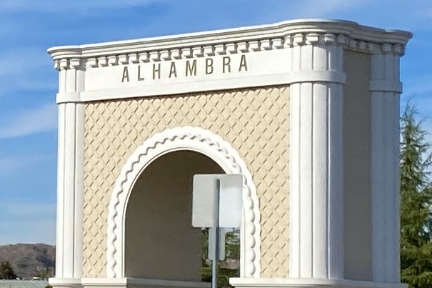 The Moorish gateway arch on West Valley Boulevard in Alhambra, lettered ALHAMBRA across the top.